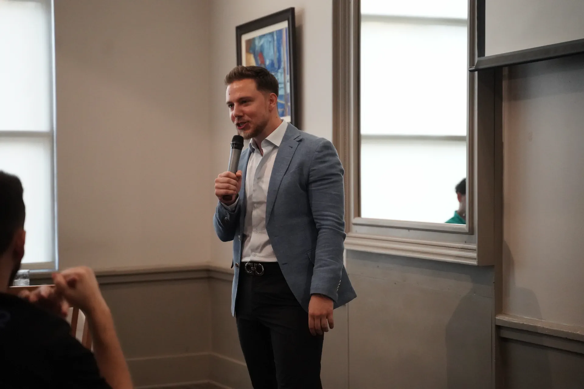 Zak Kuzbari speaking at a dinner